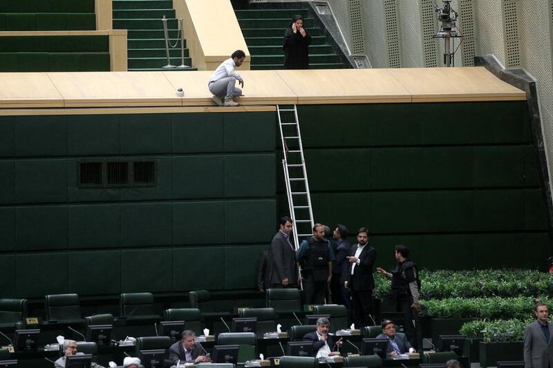 Iranian policemen are deployed inside the parliament building to protect Iranian lawmakers during an attack in Tehran. EPA