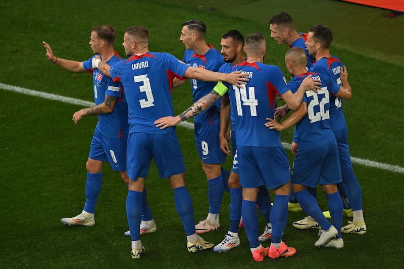 Slovakia's Ivan Schranz celebrates scoring the opening goal with his teammates. AFP