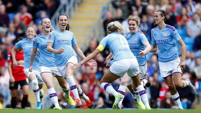 Manchester City's Caroline Weir, centre, celebrates after scoring the winning goal against Manchester United. Reuters