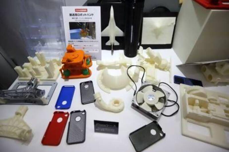 Products made by 3D printers are displayed at the Stratasys booth at the 3D & Virtual Reality Exhibition in Tokyo. Stratasys agreed to buy MakerBot Industries for at least $403 million in June. Tomohiro Ohsumi / Bloomberg News