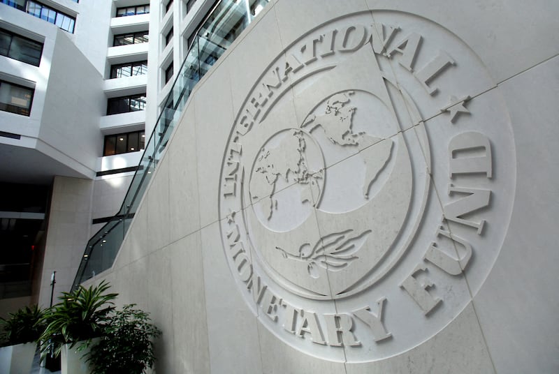 The International Monetary Fund's offices in Washington. The fund expects the rise in oil and gas prices to stoke inflation and hit growth. Reuters
