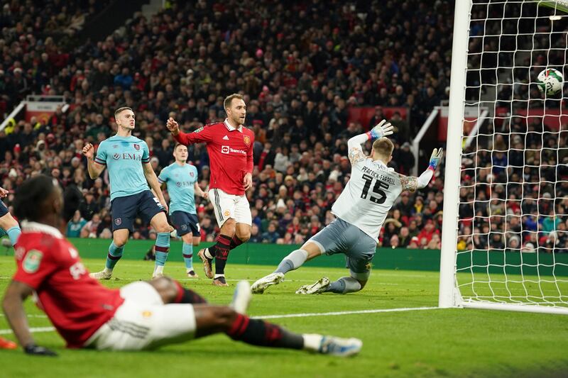 Manchester United's Christian Eriksen scores the opening goal past Burnley's goalkeeper Bailey Peacock-Farrell. AP