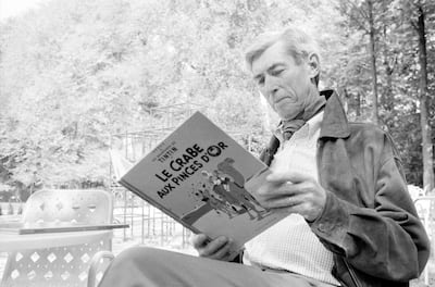 BRUSSELS, BELGIUM -  MAY 13: Herge reads a Tintin comic on May 13, 1982 in Brussels,Belgium.(Photo by Bernard CHARLON/Gamma-Rapho via Getty Images)