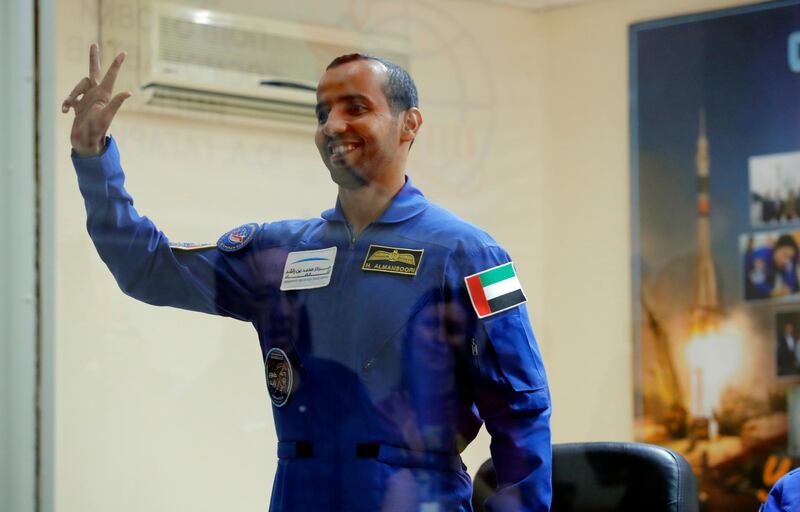 Major Al Mansouri gives a wave before retiring for his last night on Earth before take-off. Dmitri Lovetsky / AP