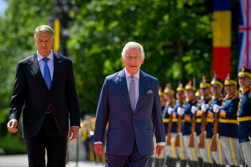 Britain's King Charles III reviews a guard of honour with Romanian President Klaus Iohannis during a welcoming ceremony at the Cotroceni Presidential Palace in Bucharest, Romania. AP