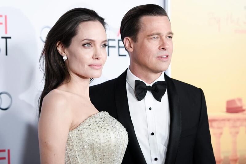 Angelina Jolie, left, and Brad Pitt arrive for AFI Fest’s opening night debut of By The Sea in Los Angeles. Richard Shotwell / Invision / AP Photo