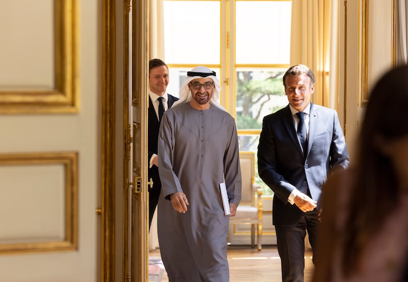 Sheikh Mohamed is welcomed to Elysee Palace by Mr Macron. Photo: Presidential Court