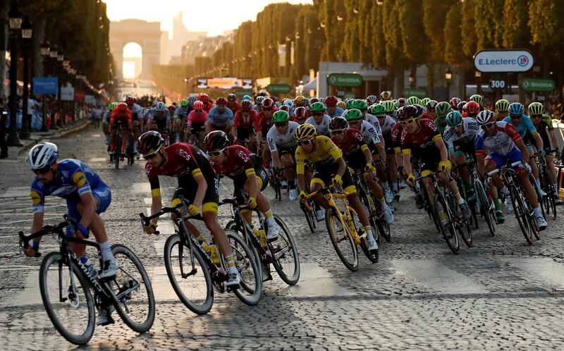 FILE PHOTO: Cycling - Tour de France - The 128-km Stage 21 from Rambouillet to Paris Champs-Elysees - July 28, 2019 - Team INEOS rider Egan Bernal of Colombia, wearing the overall leader's yellow jersey, in action in the peloton. REUTERS/Gonzalo Fuentes/File Photo