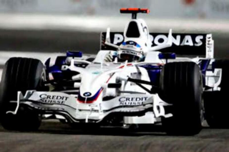 BMW Sauber Formula One driver Nick Heidfeld of Germany negotiates turn 3 during the qualifying session at the Marina Bay Singapore F1 Grand Prix circuit September 27, 2008. Ferrari's Felipe Massa of Brazil will start on pole position  for the Singapore GP on Sunday which will be F1's first night race, the first to be held in the island state and the first on an Asian street circuit.  REUTERS/Russell Boyce (SINGAPORE) *** Local Caption ***  SIN216_MOTOR-RACING_0927_11.JPG