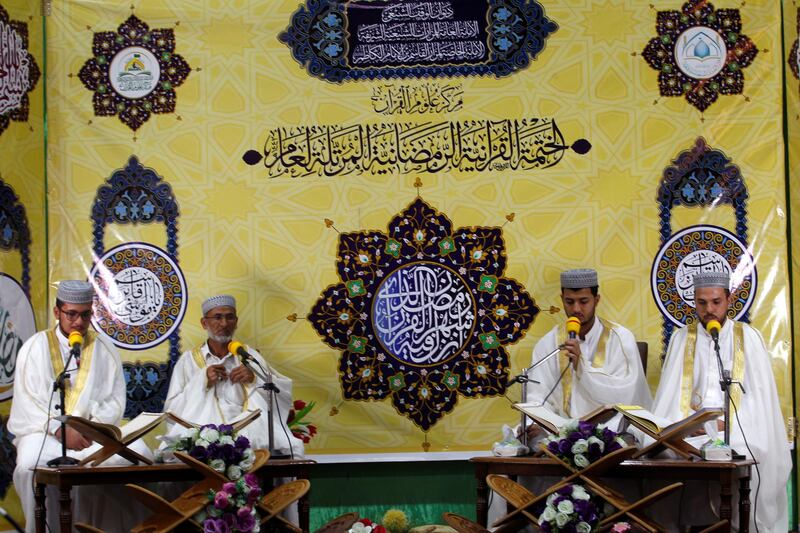 Men sit at the Al Qasim Mosque during the month of Ramadan in Hilla, Iraq. Reuters