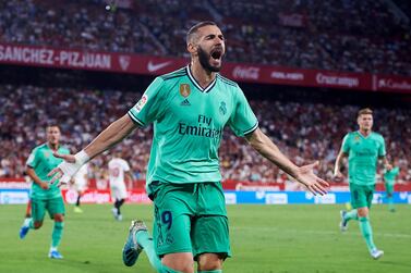 SEVILLE, SPAIN - SEPTEMBER 22: Karim Benzema of Real Madrid CF celebrates after scoring a goal during the Liga match between Sevilla FC and Real Madrid CF at Estadio Ramon Sanchez Pizjuan on September 22, 2019 in Seville, Spain. (Photo by Aitor Alcalde/Getty Images)