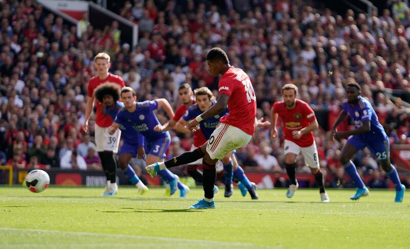 Manchester United's Marcus Rashford scores a penalty against Leicester. AFP