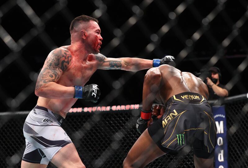 Kamaru Usman (red gloves) competes against Colby Covington (blue gloves) during UFC 268 at Madison Square Garden on November 6, 2021. Usman won via unanimous decision to retain his UFC welterweight belt. Reuters