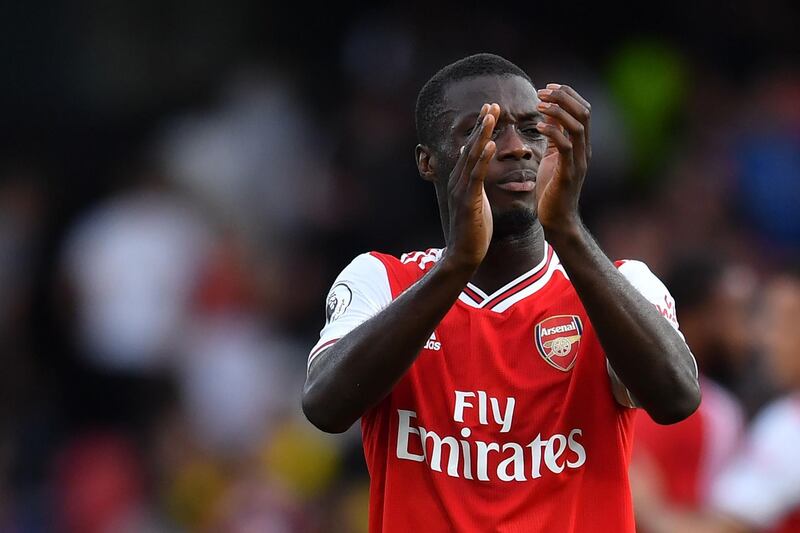 Arsenal's Ivorian midfielder Nicolas Pepe applauds the away fans. EPA