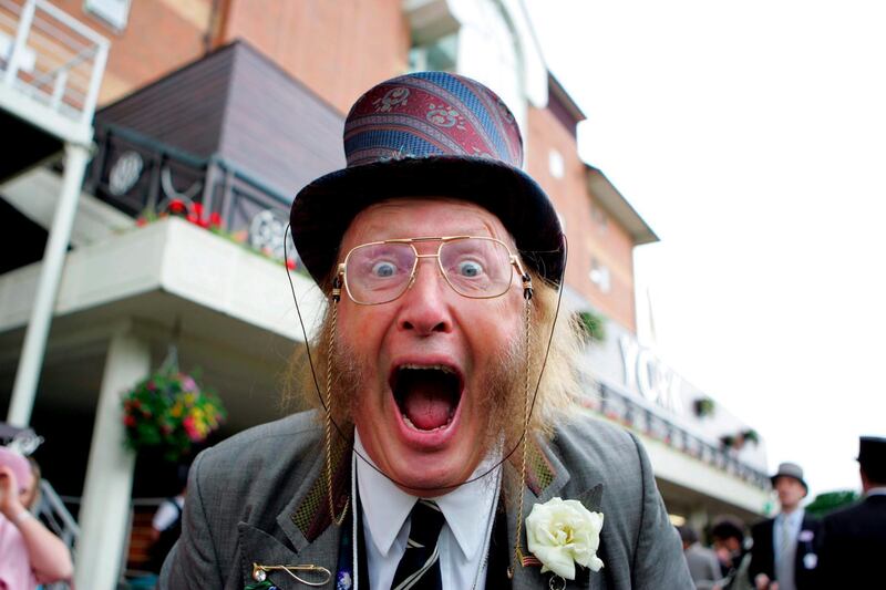 epa07696605 (FILE) - British racing character and presenter John McCririck poses for the camera at the first day of the Royal Ascot meeting in York, Britain, 14 June 2005 (reissued 05 July 2019). According to reports, John McCririck died on 05 July 2019 at teh age of 79 in a Lonodn hospital.  EPA/PATRICK MCCANN *** Local Caption *** 00456587