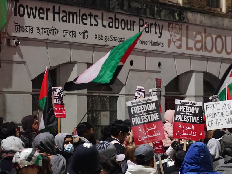 Protesters gather outside the office of the Tower Hamlets Labour Party in London to show their opposition to MP Rushanara Ali. PA