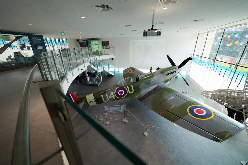 The Spitfire is displayed in a glass-fronted purpose-built gallery. PA