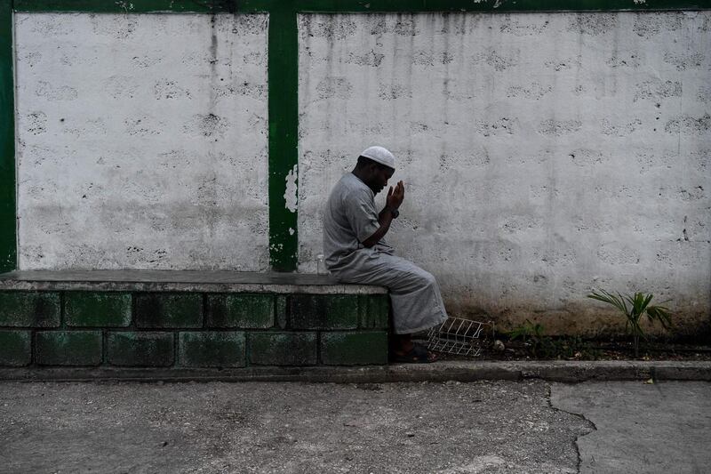 A man offer prayers before iftar in Port-au-Prince.   AFP