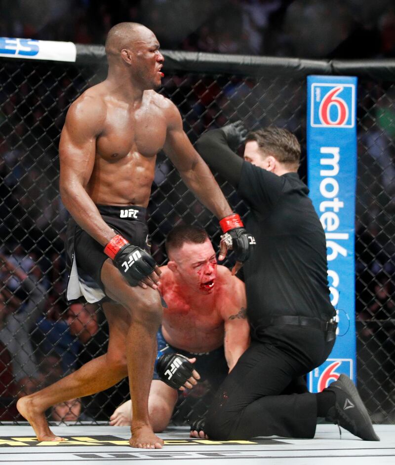 Kamaru Usman stands up after defeating Colby Covington in their mixed martial arts welterweight championship bout at UFC 245. AP