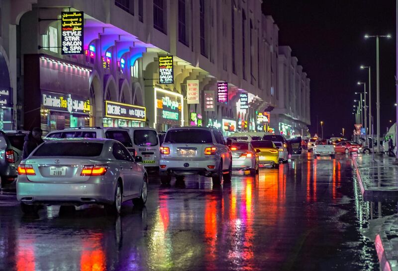 Abu Dhabi, United Arab Emirates, January 9, 2020.  A pedestrian protects himself from the elements as it pours at Khalifa City.    Victor Besa / The National