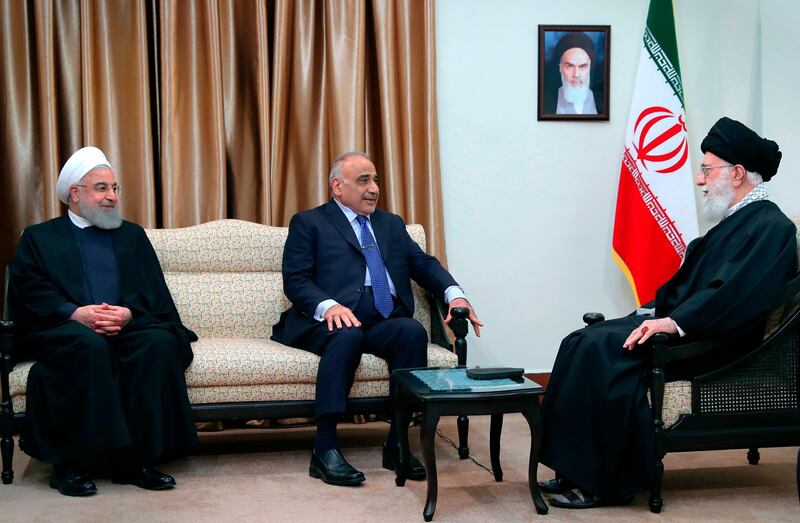 Iraqi Prime Minister Adel Abdel Mahdi, centre, speaks with Iranian Supreme Leader Ayatollah Ali Khamenei, right, as Iranian President Hassan Rouhani listens. AP