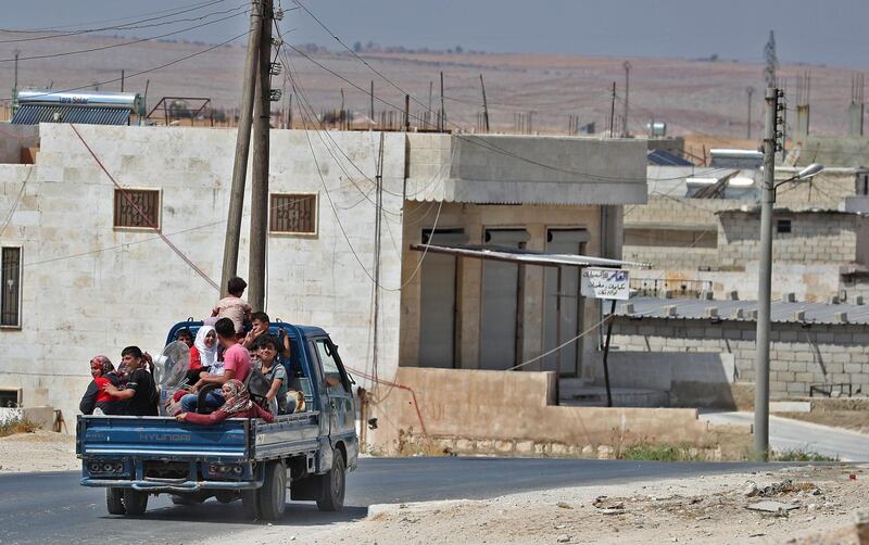 Syrian civilians flee.  AFP