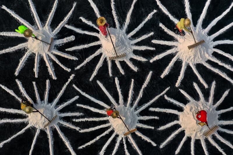 With the aerial shot which shows the hard work of some labourers in a salt pan in Habra, India, photographer Saurabh Sirohiya wins in the Abstract category.