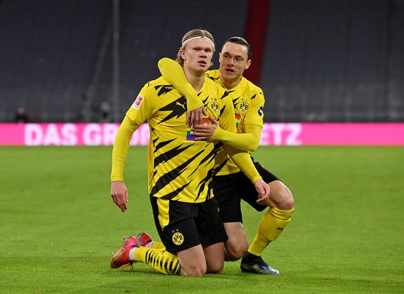 Erling Haaland celebrates with teammate Nico Schulz  after giving Borussia Dortmund the lead. EPA