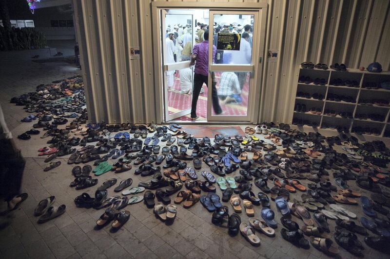 Abu Dhabi, United Arab Emirates, July 24, 2013   :   Men stream into their local mosque to join in the first morning prayer on Wednesday morning, July 24, 2013, at the Saadiyat Accommodation Village on the Saadiyat Island in Abu Dhabi. About half of the men currently living at the workers' village are the Louvre Abu Dhabi joint venture employees. Many of them, about 60 percent of the workforce, fast for the entire duration of the Holy Month of Ramadan. 
Silvia Razgova / The National

Restricted!!!
Reporter: James Langton



 *** Local Caption ***  sr-130724-louvreramadan0482.jpg sr-130724-louvreramadan0482.jpg