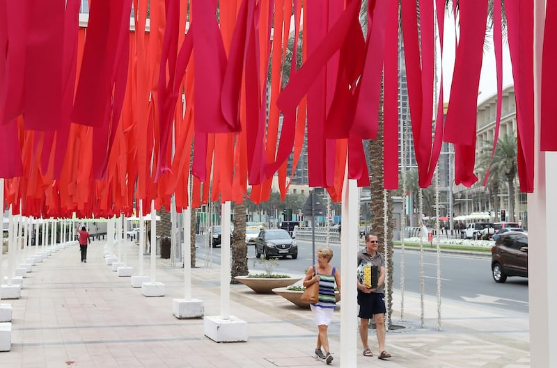 DUBAI , UNITED ARAB EMIRATES , MARCH 1  – 2018 :- Emmanuelle Moureaux , French Artist based in Tokyo with her famous 100 shades of colour art work in Downtown Dubai in Dubai. ( Pawan Singh / The National ) For Arts & Life. Story by Chris