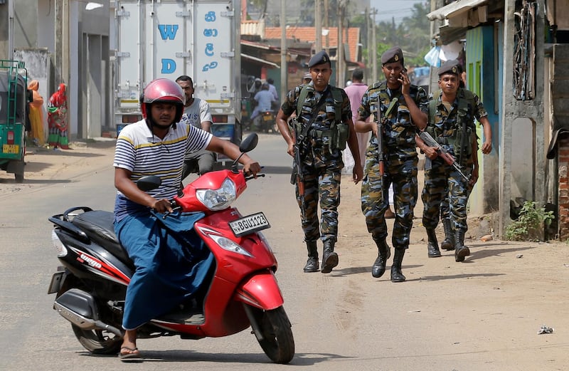 Sri Lankan air force soldiers patrol a Muslim neighborhood following overnight clashes in Poruthota, a village in Negombo, about 35 kilometers North of Colombo, Sri Lanka, Monday, May 6, 2019. Two people have been arrested and an overnight curfew lifted Monday after mobs attacked Muslim-owned shops and some vehicles in a Sri Lankan town where a suicide bombing targeted a Catholic church last month. Residents in the seaside town of Negombo say the mostly-Catholic attackers stoned and vandalized shops. It is unclear how the dispute began but most residents say a private dispute took a religious turn. (AP Photo/Eranga Jayawardena)