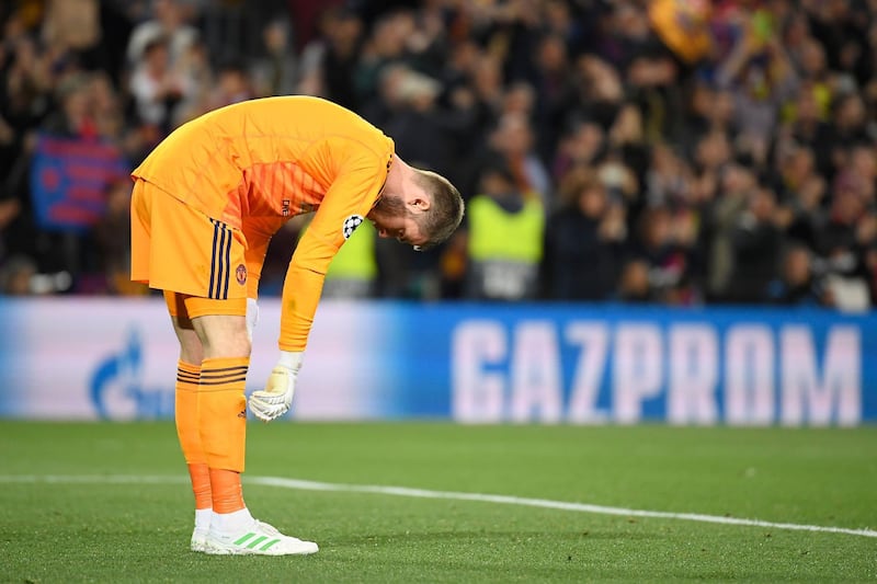 Manchester United's Spanish goalkeeper David De Gea reacts after Barcelona's Brazilian midfielder Philippe Coutinho scores. AFP