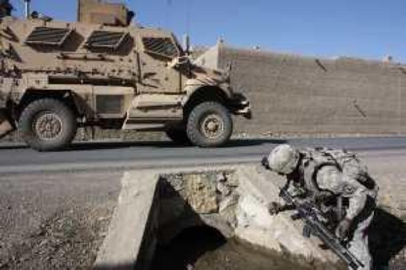 United States soliders of Hammer battery, 4th Battalion, 25th Field
Artillery, 10th Mountain Division, must check the culverts of roads
each day for roadside bombs in Jalrez Valley, Wardak province near
Kabul. The incidence of roadside bombs has risen 80 per cent since
last year and now accounts for thrre fifths of all international
casualties. Among Afghans the death toll is far higher. (Picture
credit: Ben Farmer)