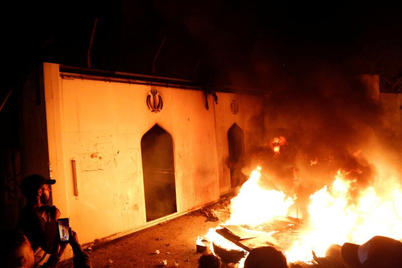 Demonstrators set fire in front of the Iranian consulate, as they gather during ongoing anti-government protests in Najaf, Iraq November 27, 2019. Reuters