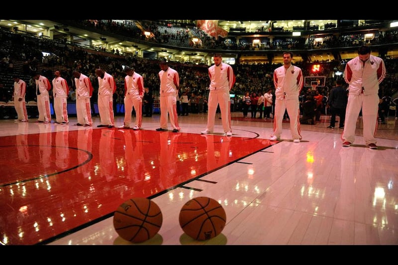 Members of the Toronto Raptors observe a moment of silence in remembrance of the shooting victims at Sandy Hook Elementary School in Newtown Connecticut. Mike Cassese / Reuters