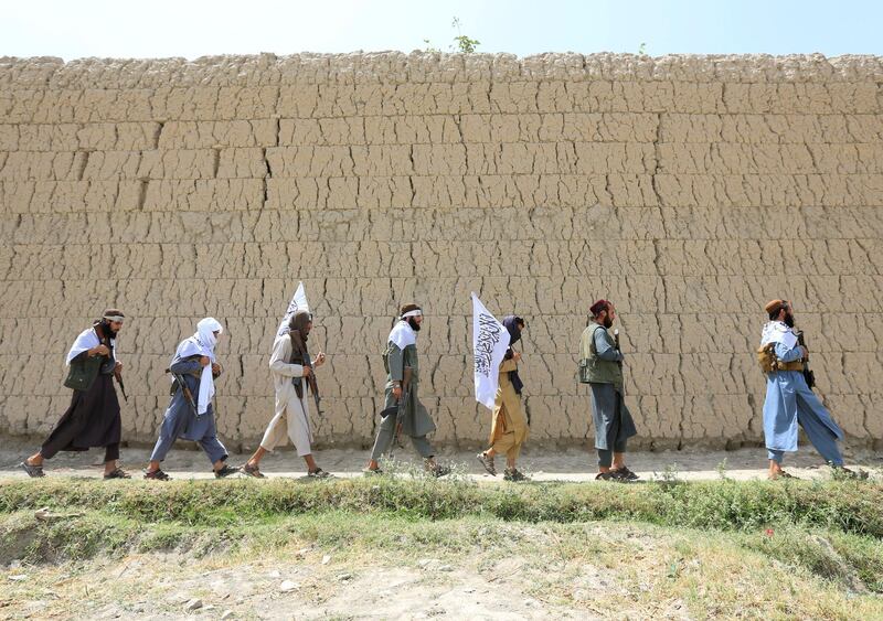 Taliban walk as they celebrate ceasefire in Ghanikhel district of Nangarhar province, Afghanistan, on June 16, 2018. Parwiz / Reuters