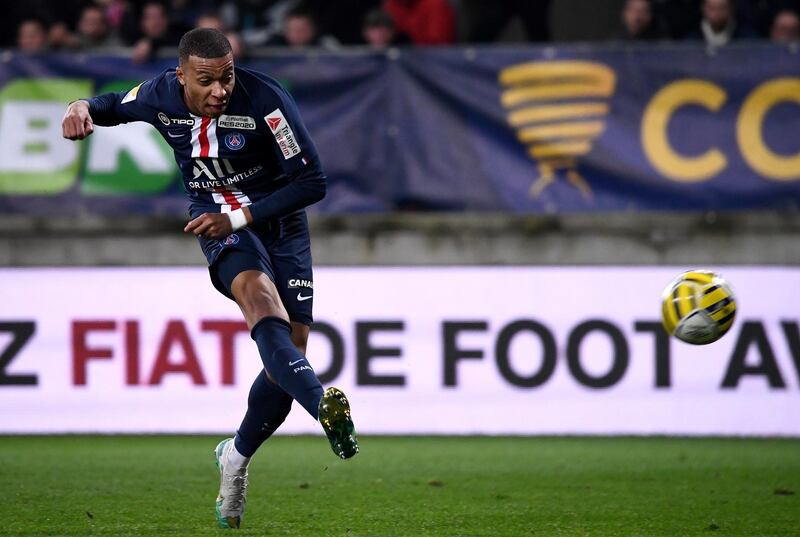 Paris Saint-Germain's French forward Kylian MBappe shoots and scores a goal during the French League Cup round of sixteen football match between Le Mans FC and Paris Saint-Germain (PSG), on December 18, 2019, at the MMArena Stadium, in Le Mans, northwestern France. (Photo by FRANCK FIFE / AFP)