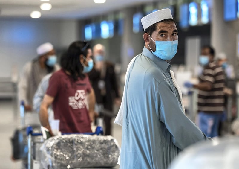 Abu Dhabi, United Arab Emirates, July 8, 2020.   
Abu Dhabi International Airport Media Tour by Etihad.  Passengers at the Etihad Check-In area.
Victor Besa  / The National
Section:  NA 
Reporter: