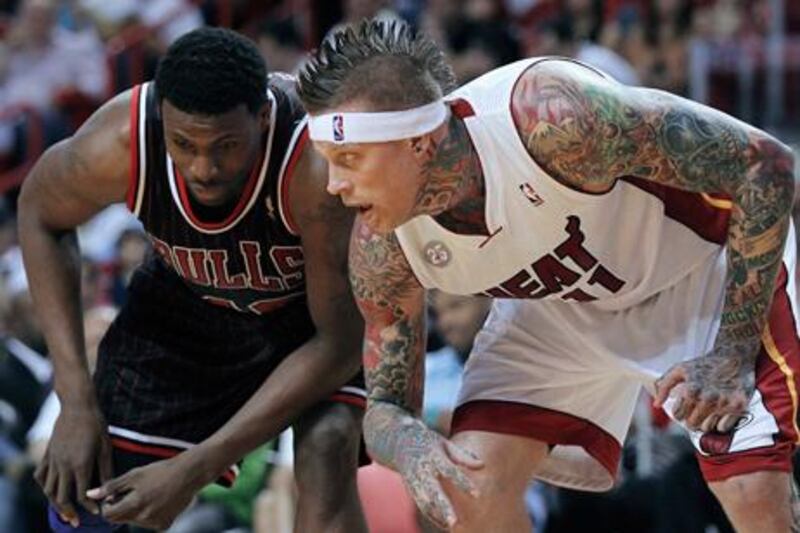 Chicago's Nazr Mohammed and Chris Andersen of the Miami Heat prepare for a rebound.