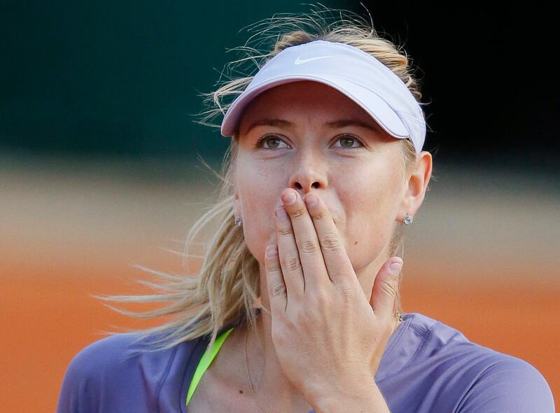 Maria Sharapova of Russia blows a kiss to spectators after defeating Sloane Stephens of the U.S. in their women's singles match during the French Open tennis tournament at the Roland Garros stadium in Paris June 3, 2013. Sharapova showed Stephens how far she has to go to become a grand slam contender, scoring a 6-4 6-3 victory on Monday to reach the quarter-finals of the French Open.  REUTERS/Gonzalo Fuentes (FRANCE  - Tags: SPORT TENNIS)   *** Local Caption ***  RGT267_TENNIS-OPEN-_0603_11.JPG