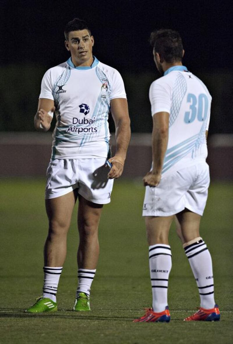  Justin Walsh, left, and Clint Berkenshaw during a timeout during the UAE's match against Lloyd's RFC  at Dubai Sevens. Jeff Topping for The National 