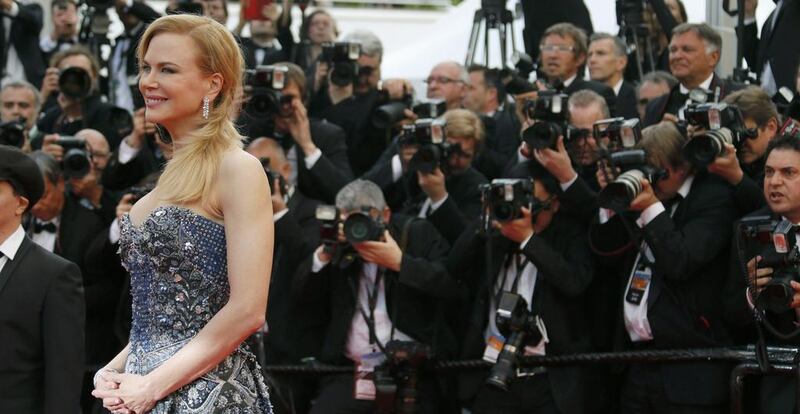 Cast member Nicole Kidman poses on the red carpet as she arrives for the opening ceremony and the screening of the film "Grace of Monaco" (Grace de Monaco) out of competition during the 67th Cannes Film Festival in Cannes May 14, 2014. The festival will run from May 14 to 25.            REUTERS/Regis Duvignau (FRANCE  - Tags: ENTERTAINMENT)  