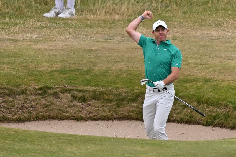 Northern Ireland's Rory McIlroy celebrates after holing a bunker shot for an eagle on the 10th hole during his third round on day 3 of The 150th Open on The Old Course at St Andrews in Scotland on July 16, 2022. AFP