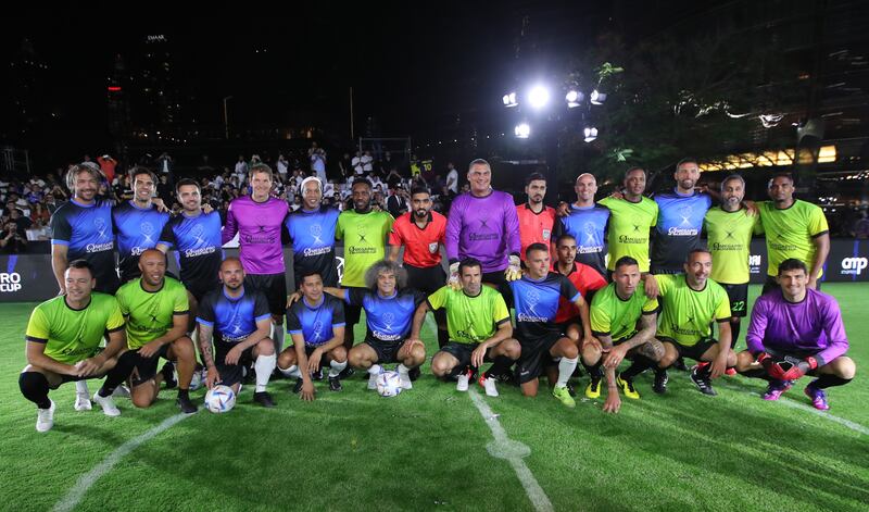 Players of team Ronaldinho (blue) and team Luis Figo (yellow) pose during the OmegaPro Legends Cup friendly exhibition. EPA