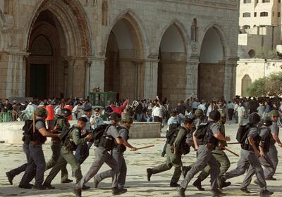 Israeli troops run as clashes erupt outside Al Aqsa Mosque compound in Jerusalem's Old City during the Second Intifada. AFP