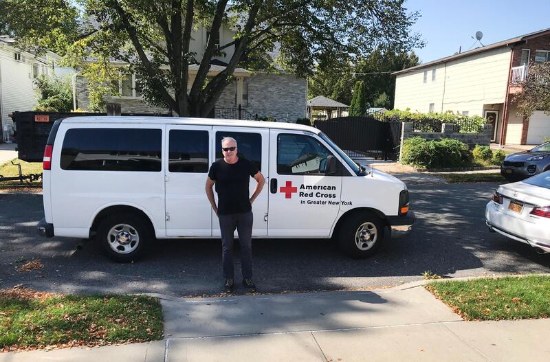 Bill Chrystal and his Red Cross van. Courtesy Red Cross