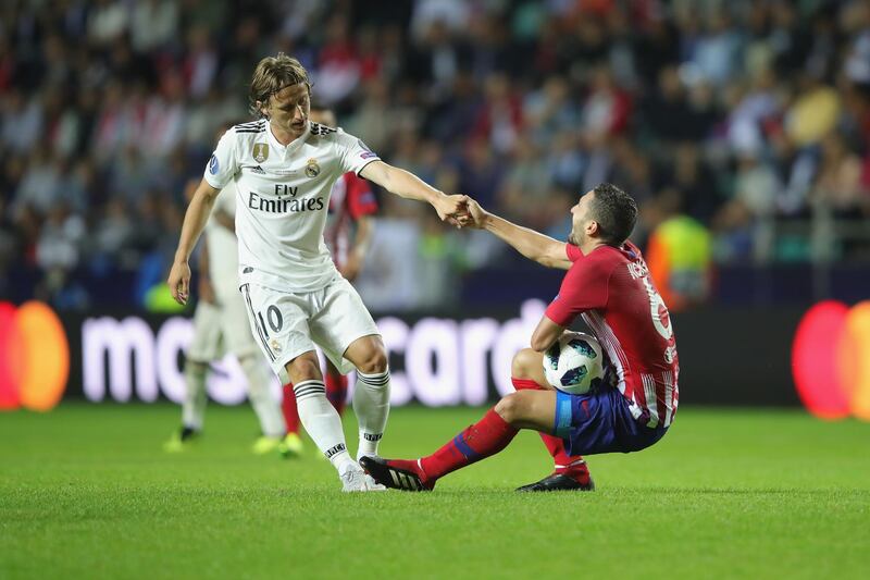Modric with Koke of Atletico. Getty