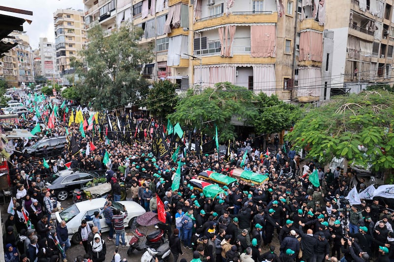 Mourners carry the coffins of Hamas officials killed on in a strike in Beirut's southern suburbs. AFP
