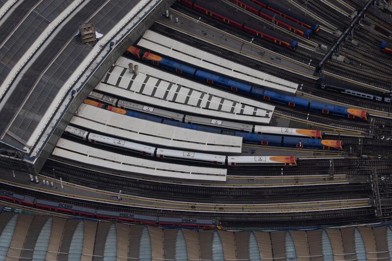 Trains at Waterloo Station. The new rules, which will expire on 2 December, also ban most indoor and outdoor household mixing and grass-roots sports. Getty Images