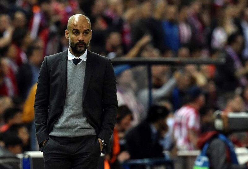 Bayern Munich manager Pep Guardiola stands during the Uefa Champions League semi-final first leg football match Club Atletico de Madrid vs Bayern Munich at the Vicente Calderon stadium in Madrid on April 27, 2016. / AFP / GERARD JULIEN